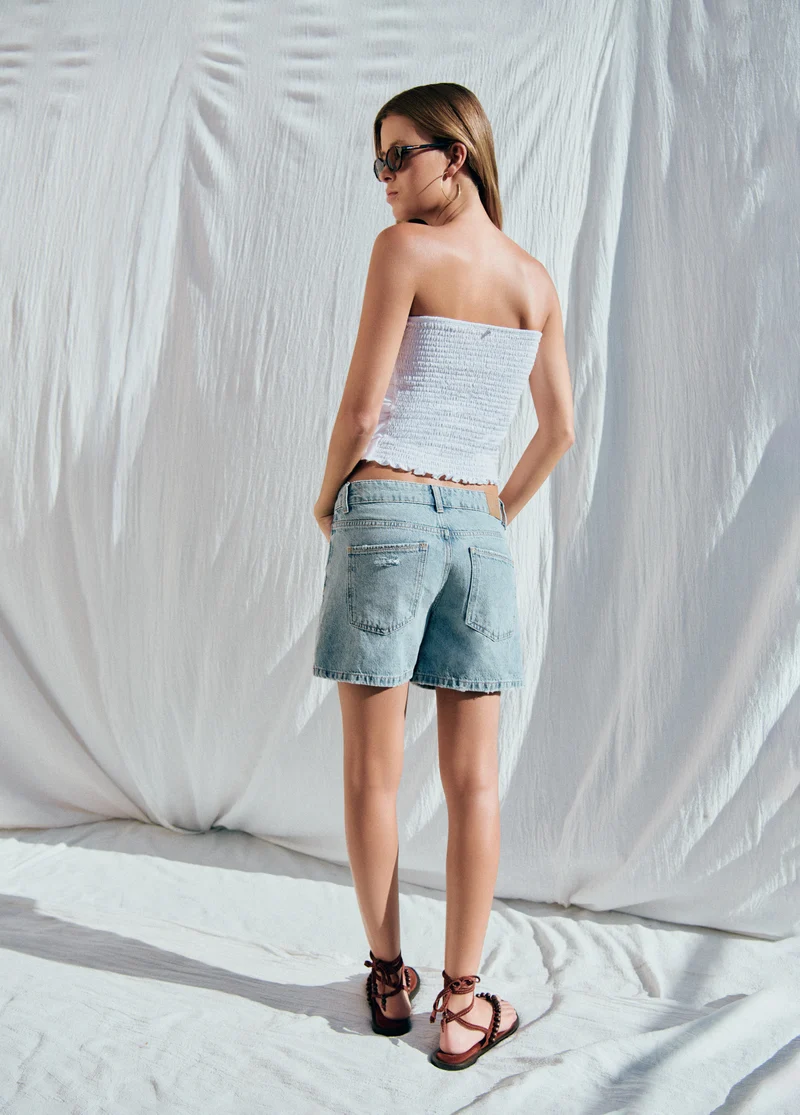 Smocked back top with multiple ruffles