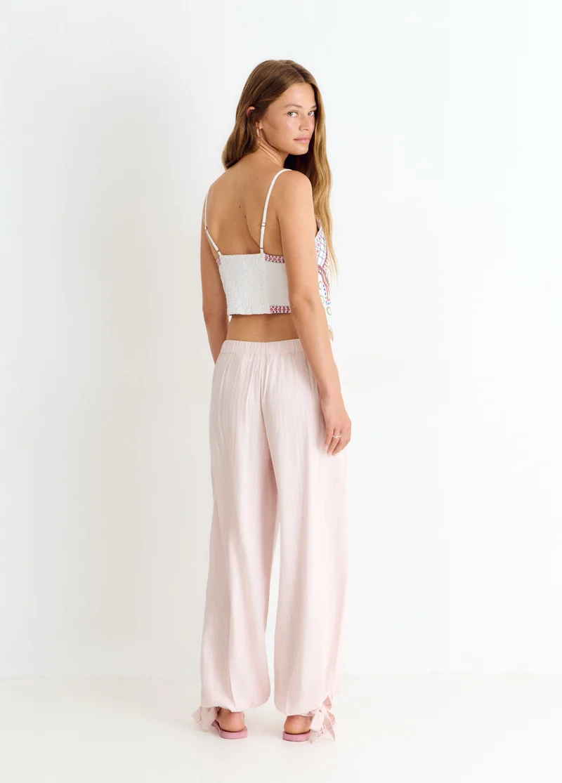 Embroidered strap top