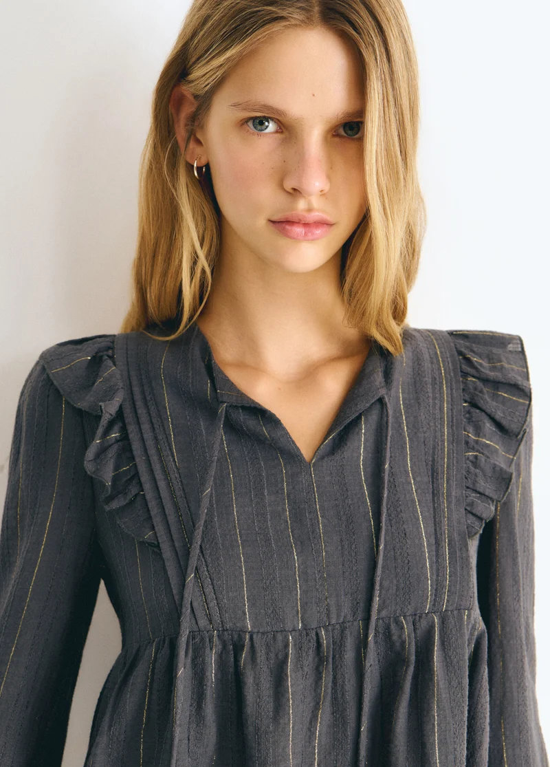 Blouse with ruffle detail and lurex stripe
