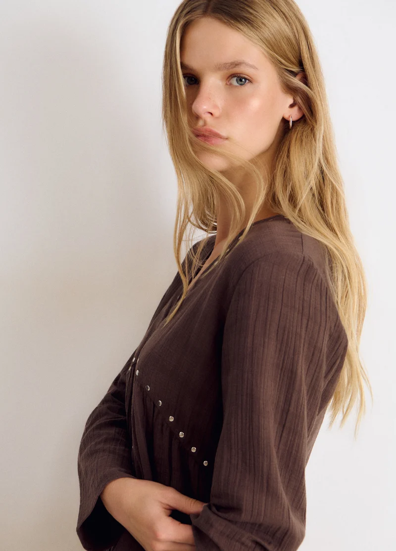 Long-sleeve studded V-neck blouse