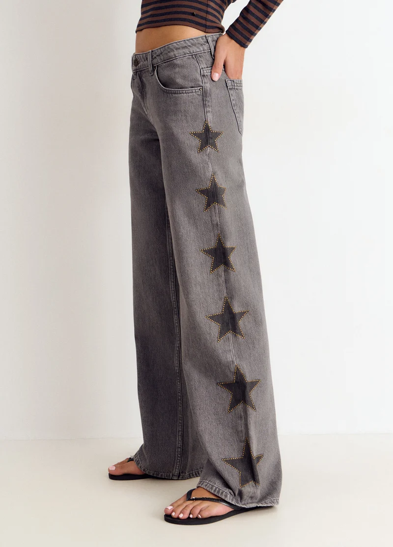 Jeans with stars and side studs
