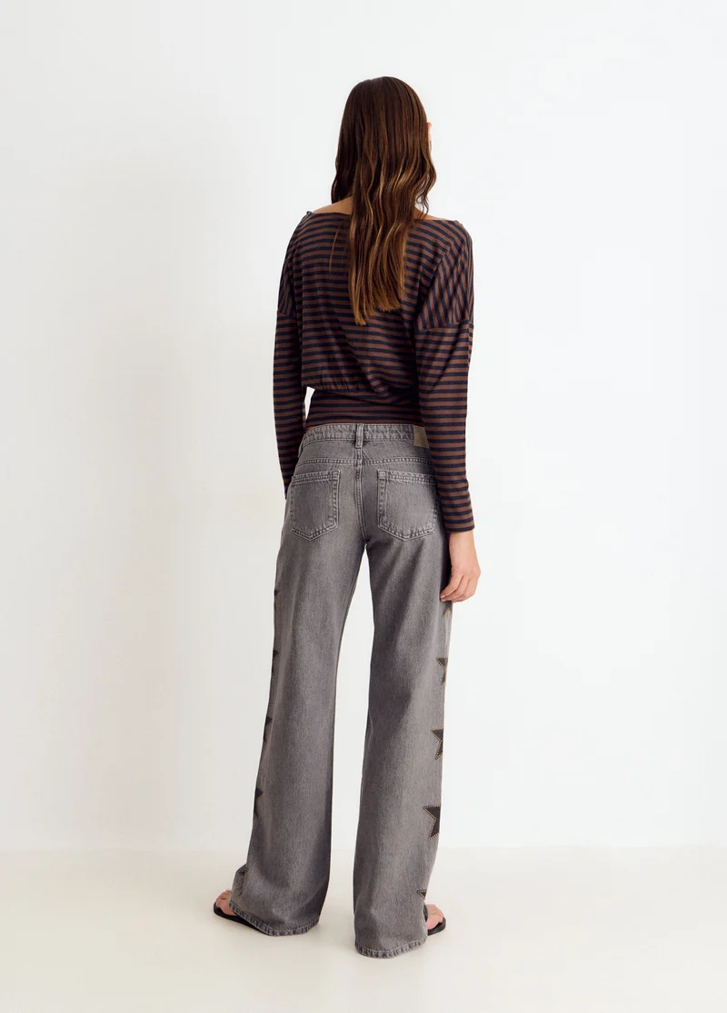 Jeans with stars and side studs