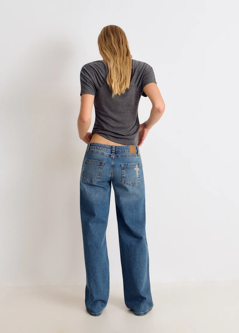 Cross-studded jeans