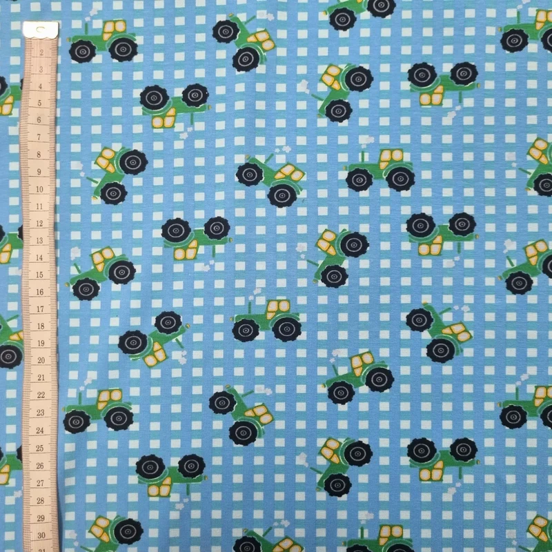Baumwolljersey mit Traktoren blau 70 cm Reststück