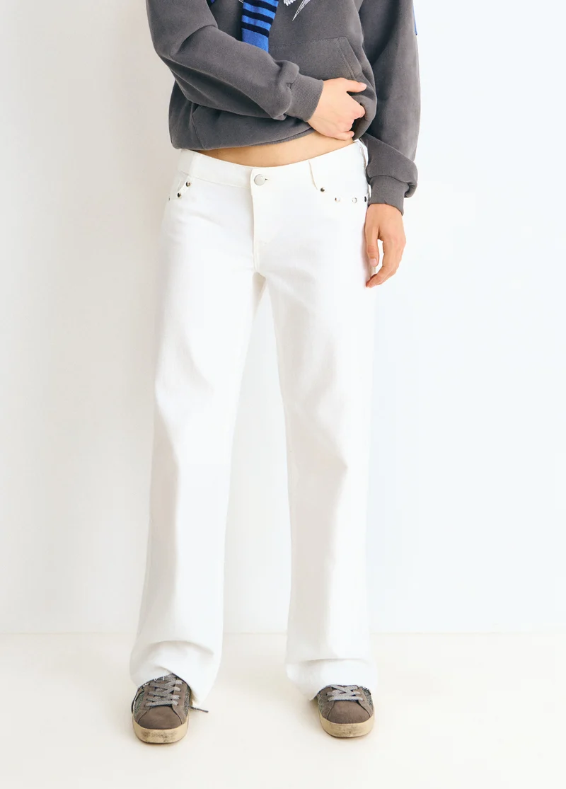 Low-rise pants with glitter stars and studs