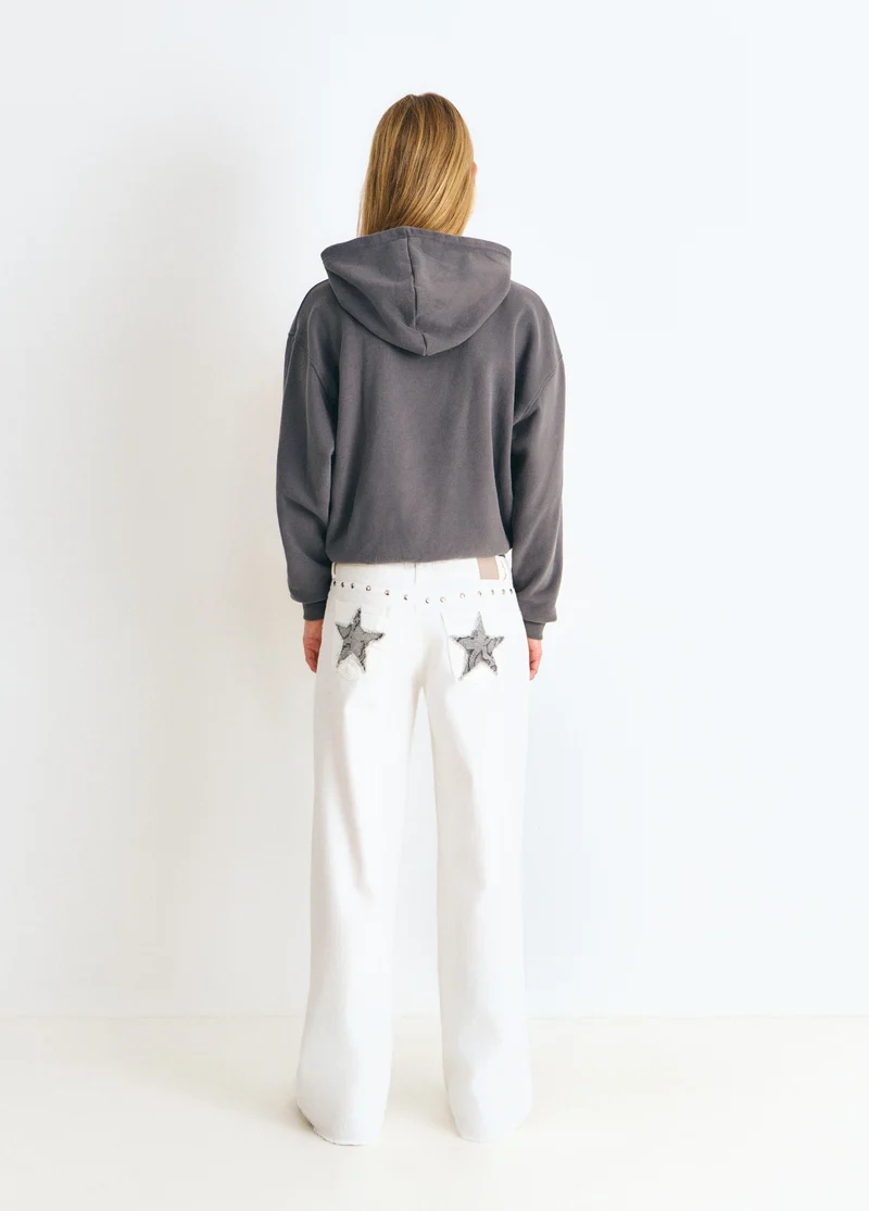 Low-rise pants with glitter stars and studs