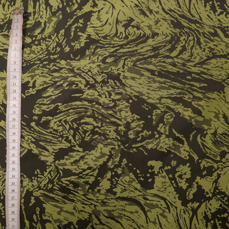 Polyesterstoff grün/schwarz | abstraktes Muster