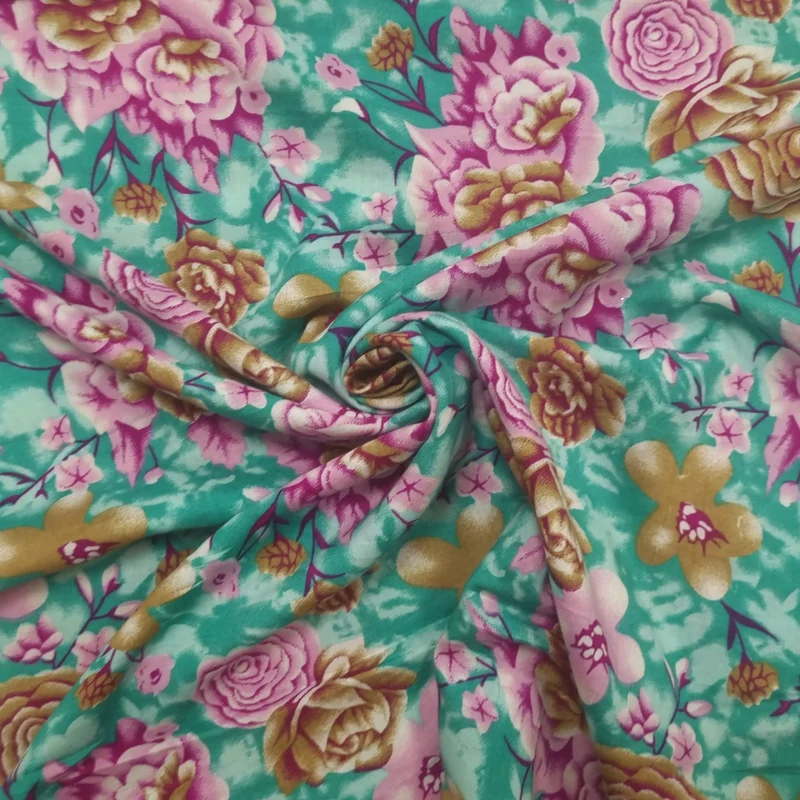 Viskosestoff mit Blumenmuster türkis