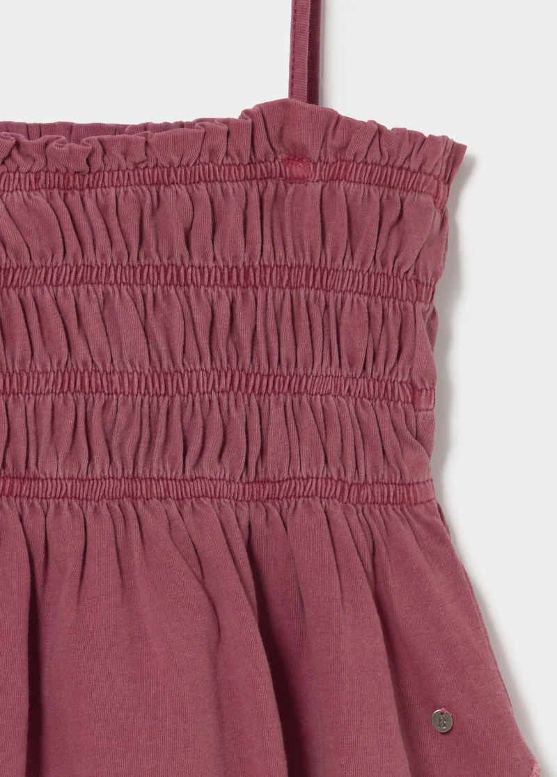 Smocked ruffle top with cut-out details